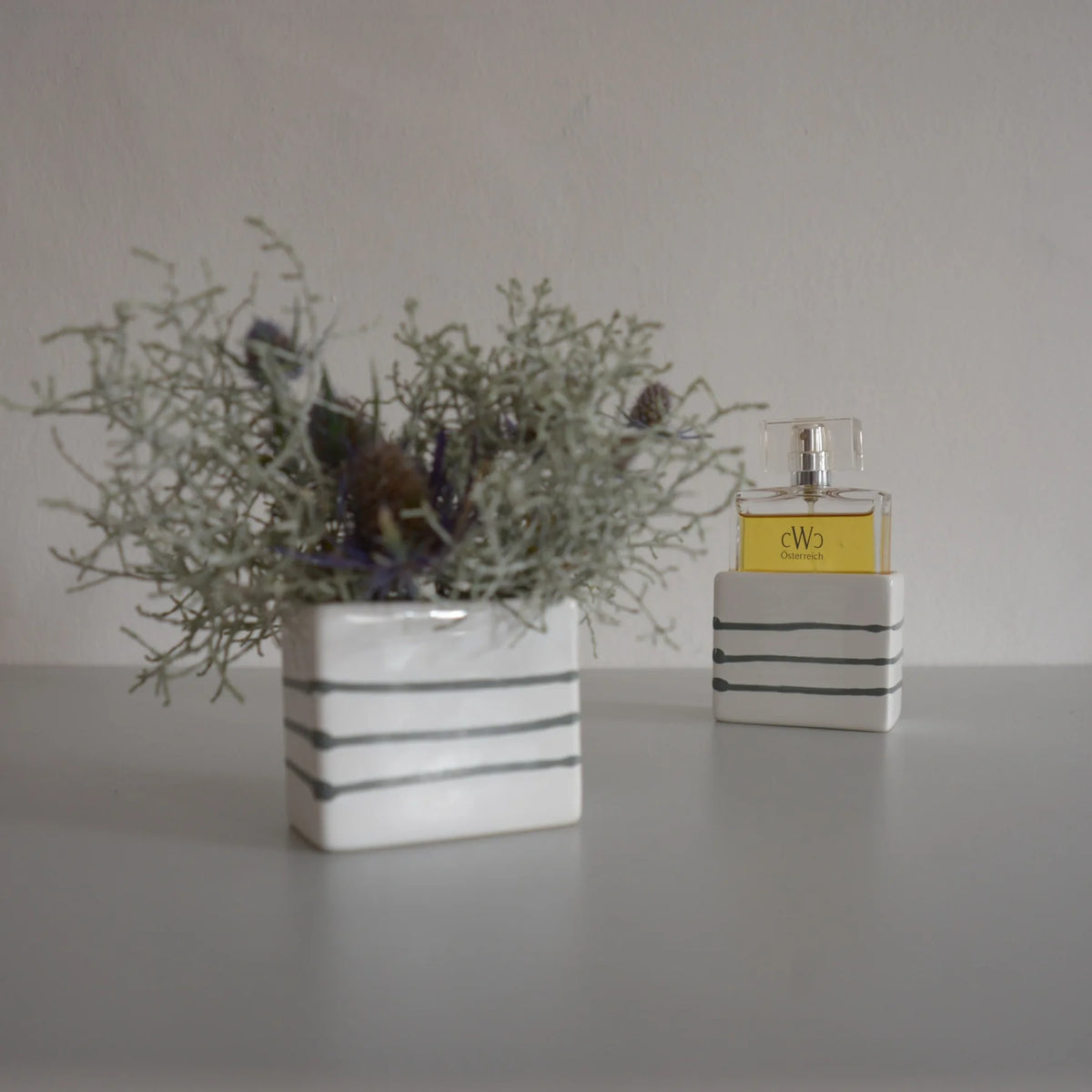 CWC GREYFLAME in GMUNDNER Keramik, with a reused ceramic sleeve as a vase